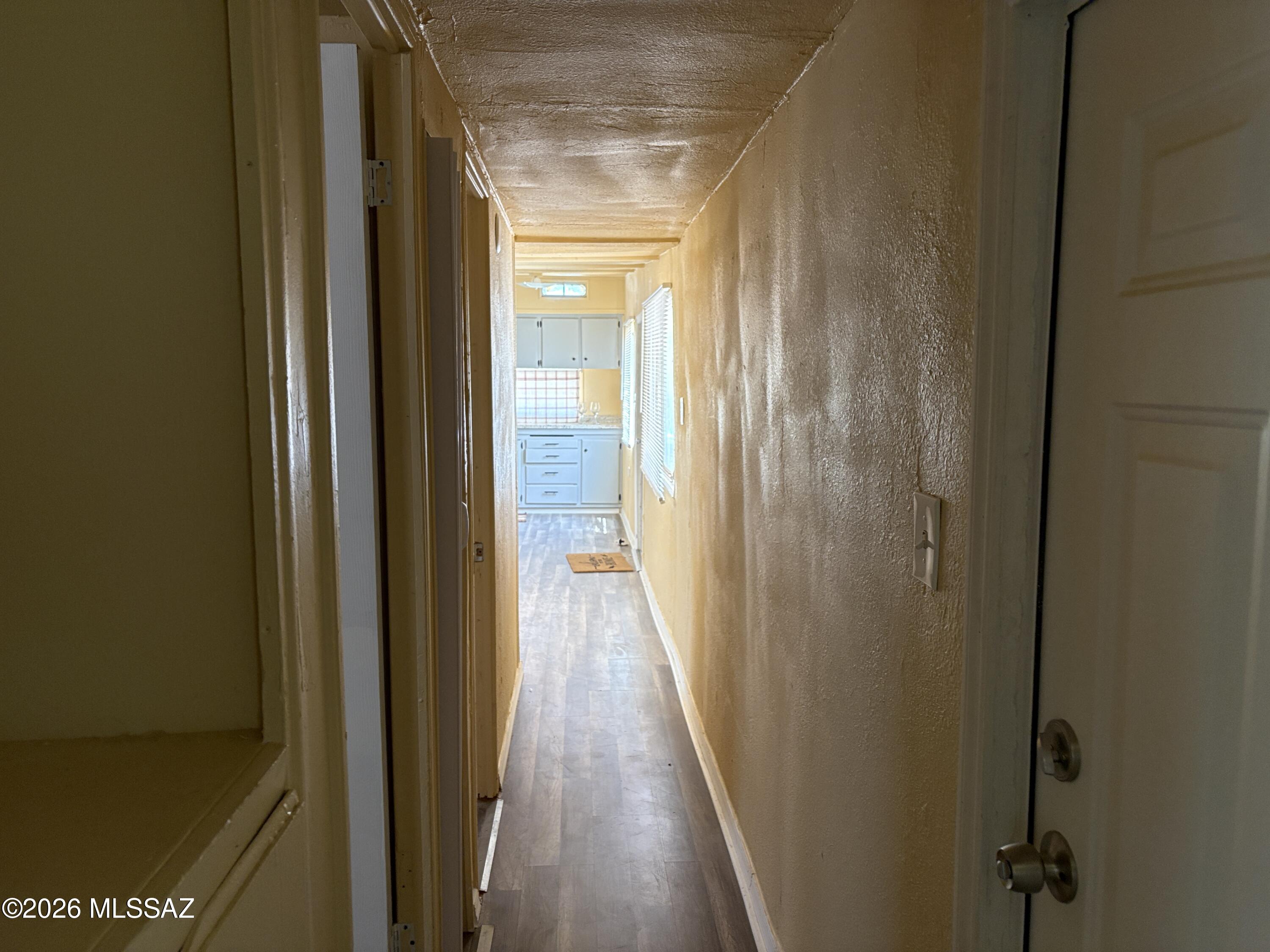 1741 West Wetmore Road, Unit 29 Tucson, AZ 85705 - Photo 10 of 10 a view of a hallway with wooden floor