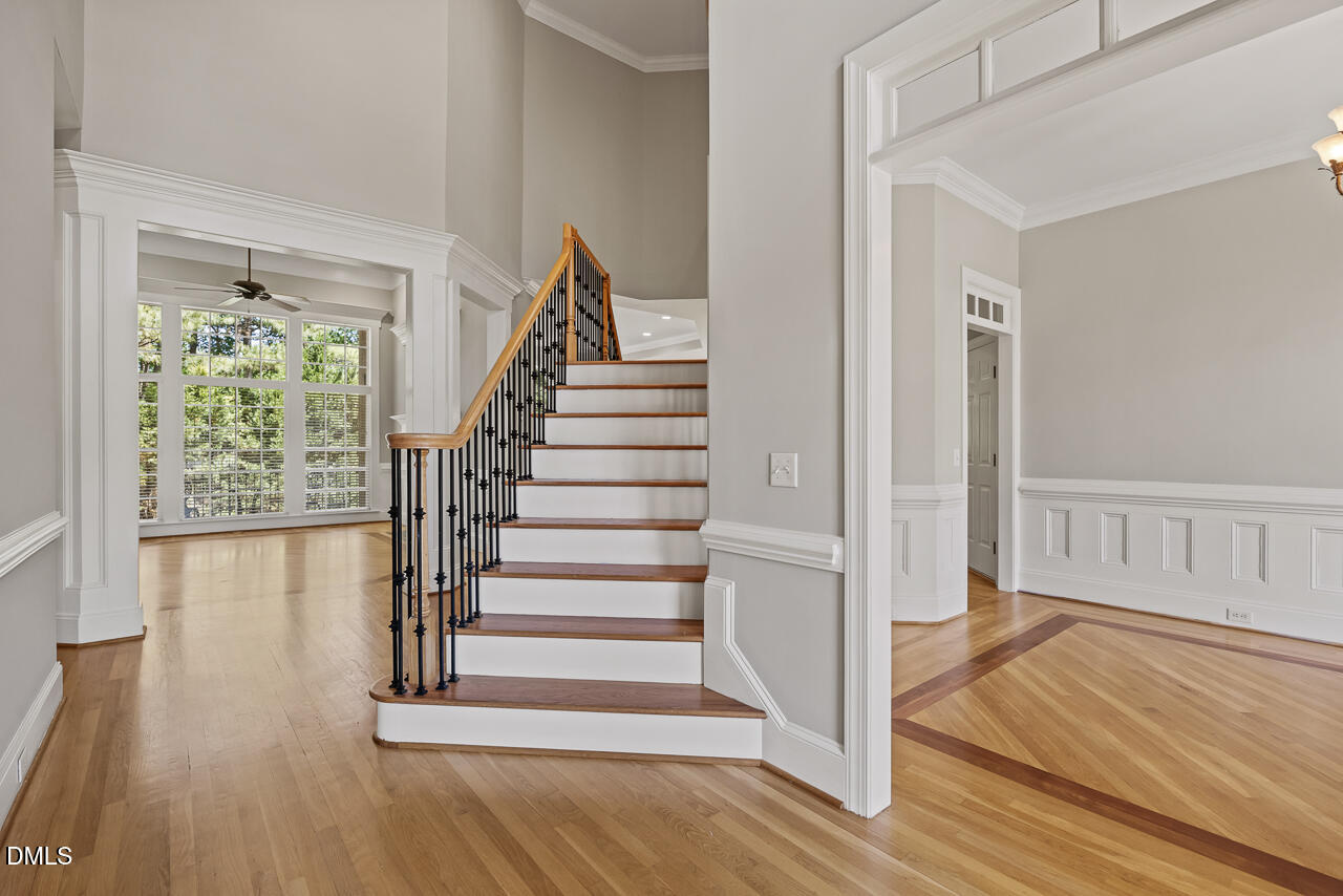 4004 Frontenac Court Apex, NC 27539 - Photo 5 of 61 a view of entryway with wooden floor and stairs