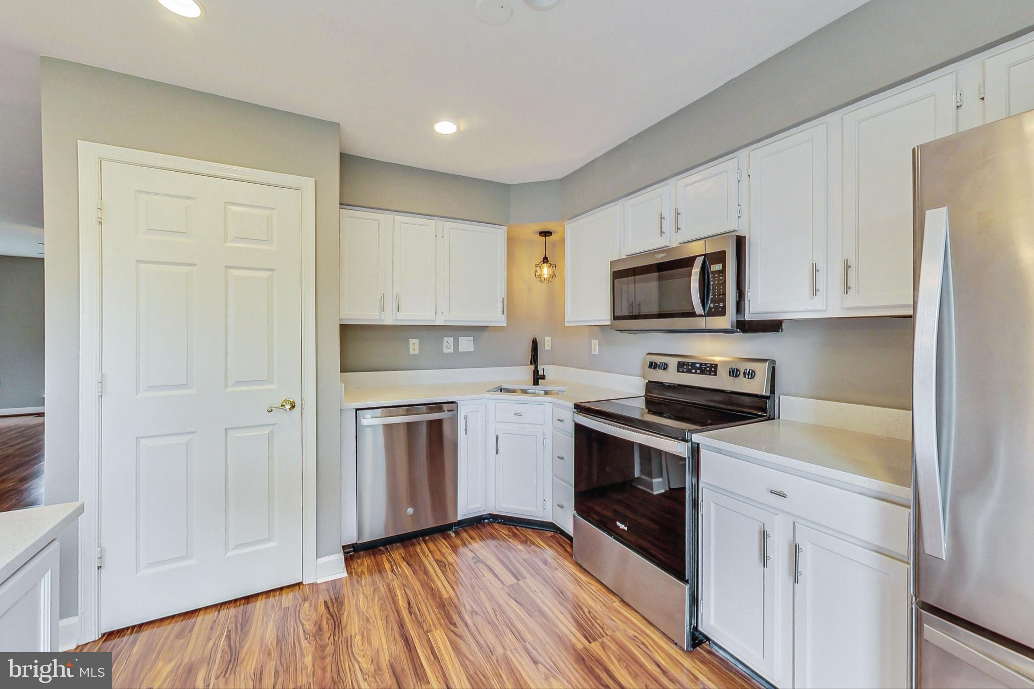 6119 Baldridge Circle Frederick, MD 21701 - Photo 11 of 43 a kitchen with a refrigerator stove top oven and sink