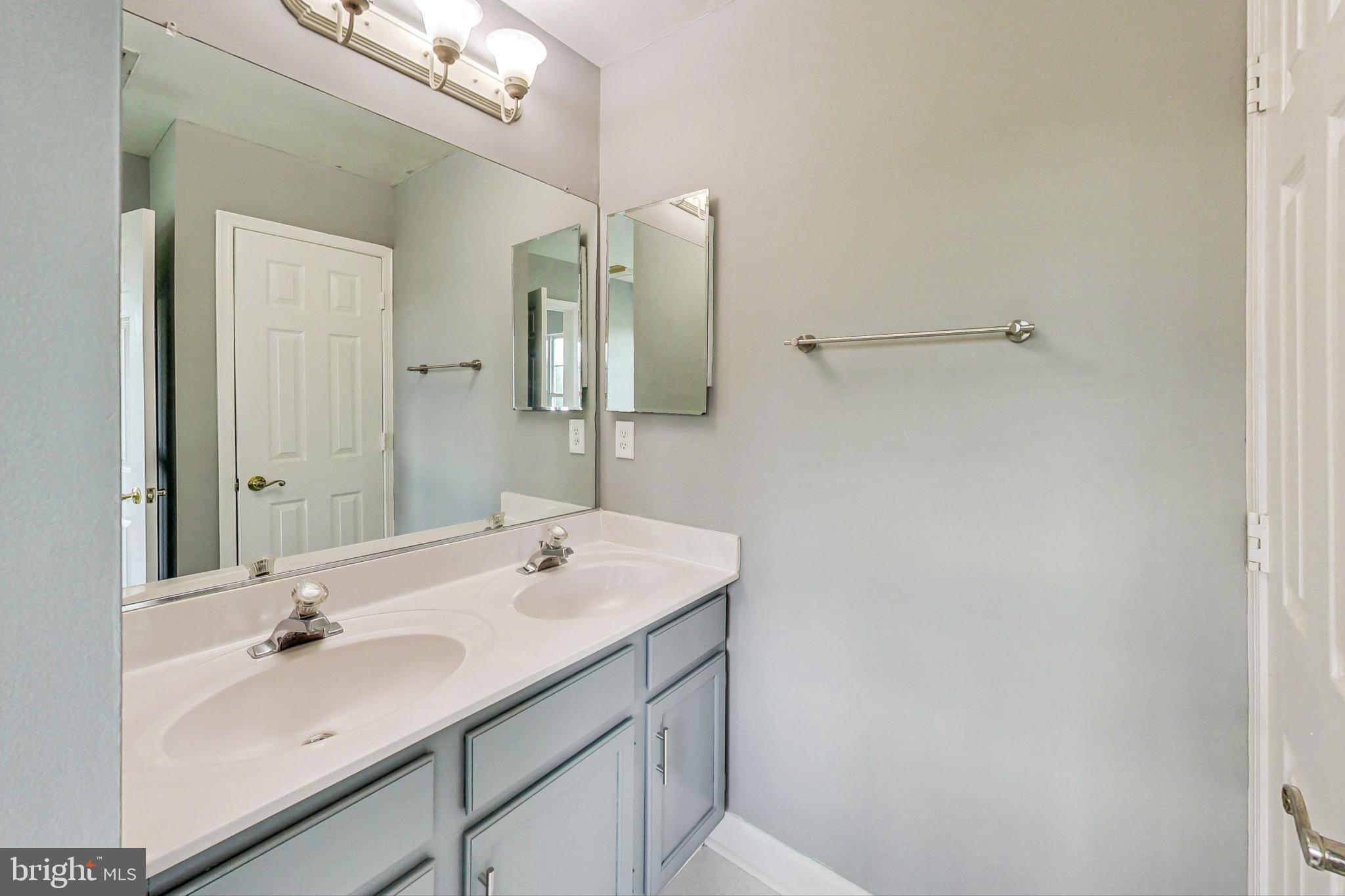 6119 Baldridge Circle Frederick, MD 21701 - Photo 19 of 43 a bathroom with a sink and a mirror