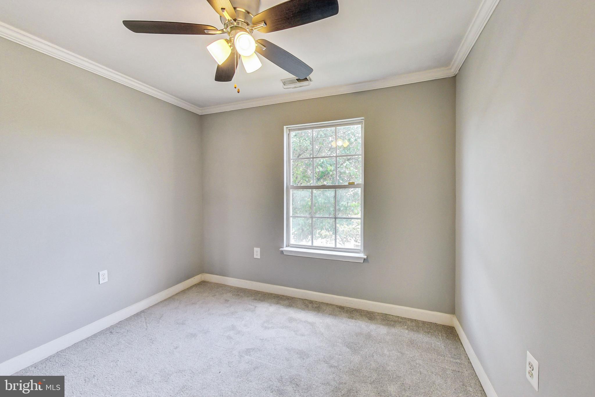 6119 Baldridge Circle Frederick, MD 21701 - Photo 25 of 43 an empty room with a window and a fan