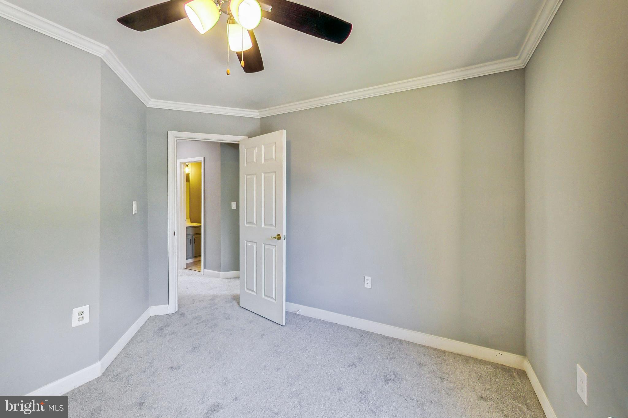 6119 Baldridge Circle Frederick, MD 21701 - Photo 26 of 43 wooden floor in an empty room with a chandelier fan