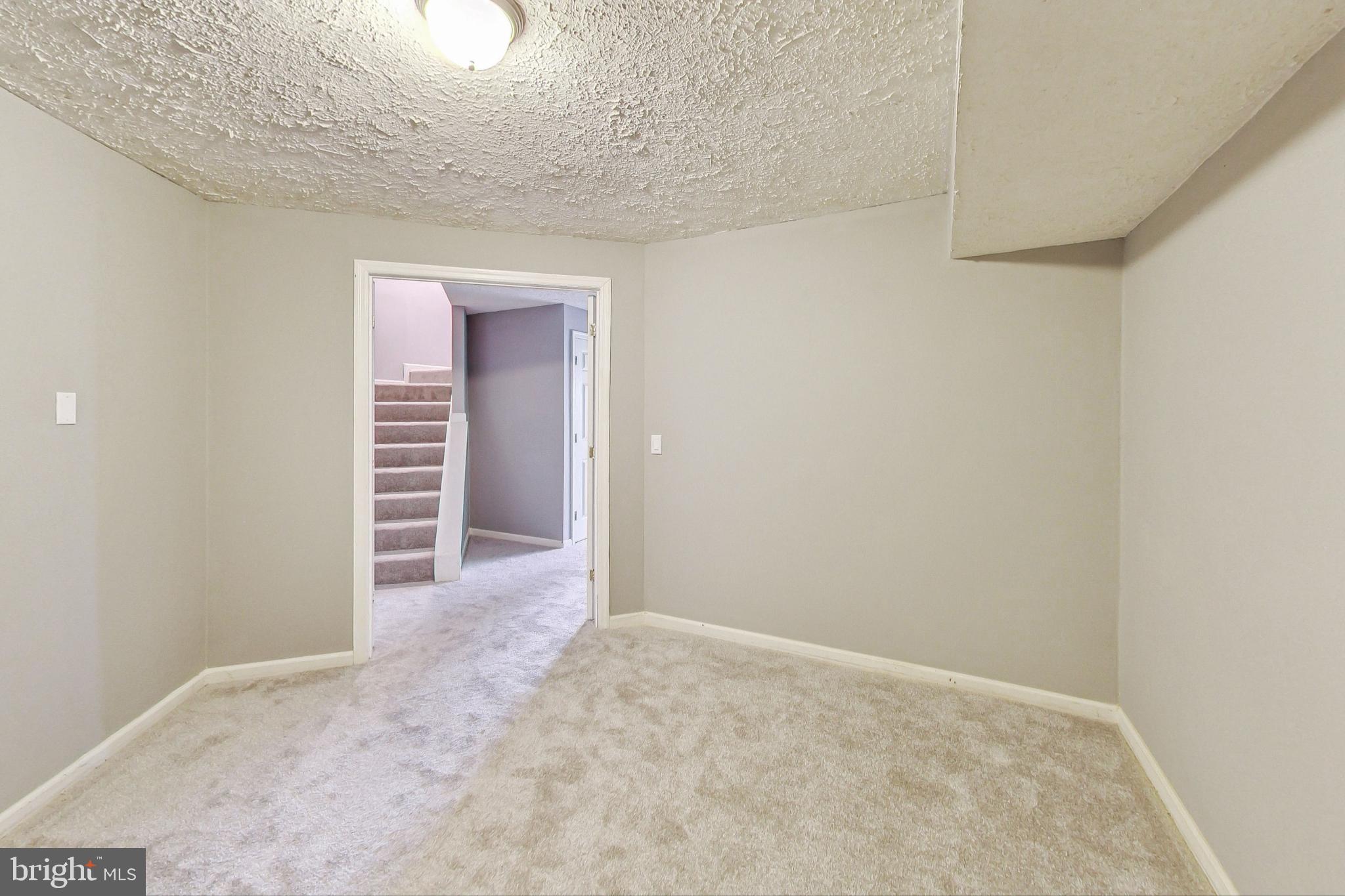 6119 Baldridge Circle Frederick, MD 21701 - Photo 33 of 43 a view of a room with a hallway