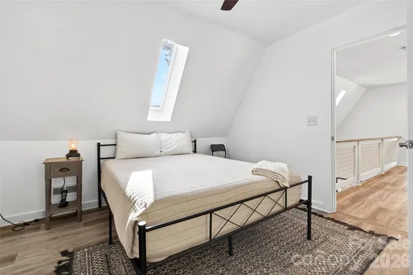 a bedroom with a bed and a table in it