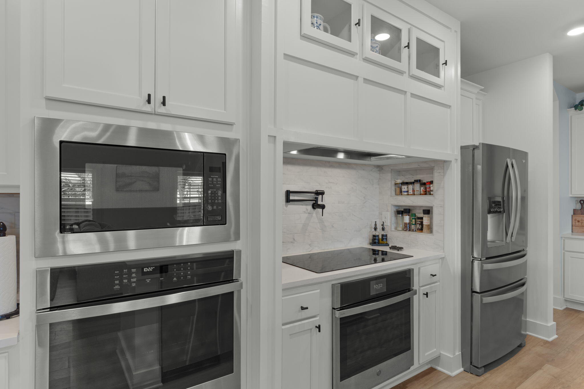 136 Hibernate Way Freeport, FL 32439 - Photo 11 of 55 a kitchen with stainless steel appliances white cabinets and a stove