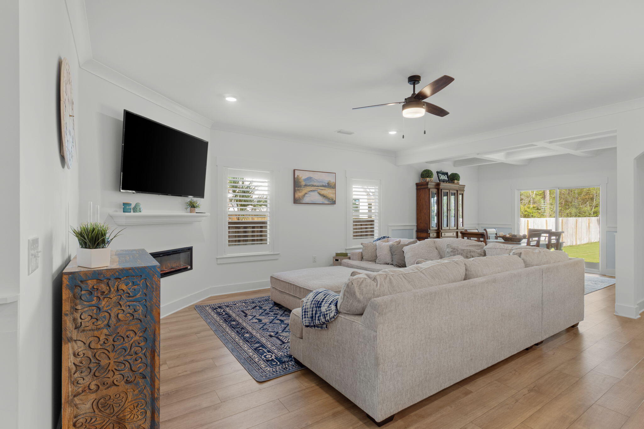 136 Hibernate Way Freeport, FL 32439 - Photo 14 of 55 a living room with furniture a fireplace and a flat screen tv