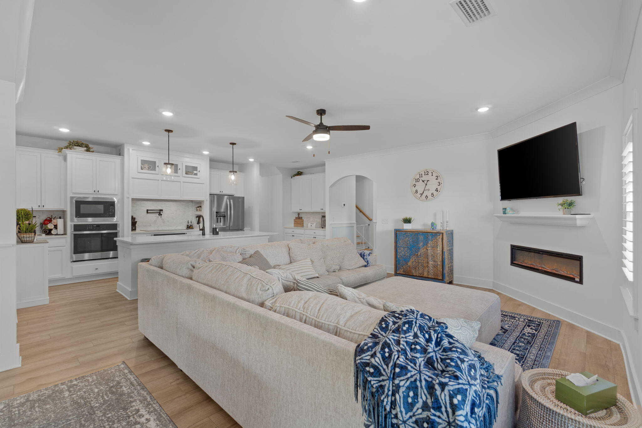 136 Hibernate Way Freeport, FL 32439 - Photo 15 of 55 a living room with furniture a flat screen tv and a fireplace