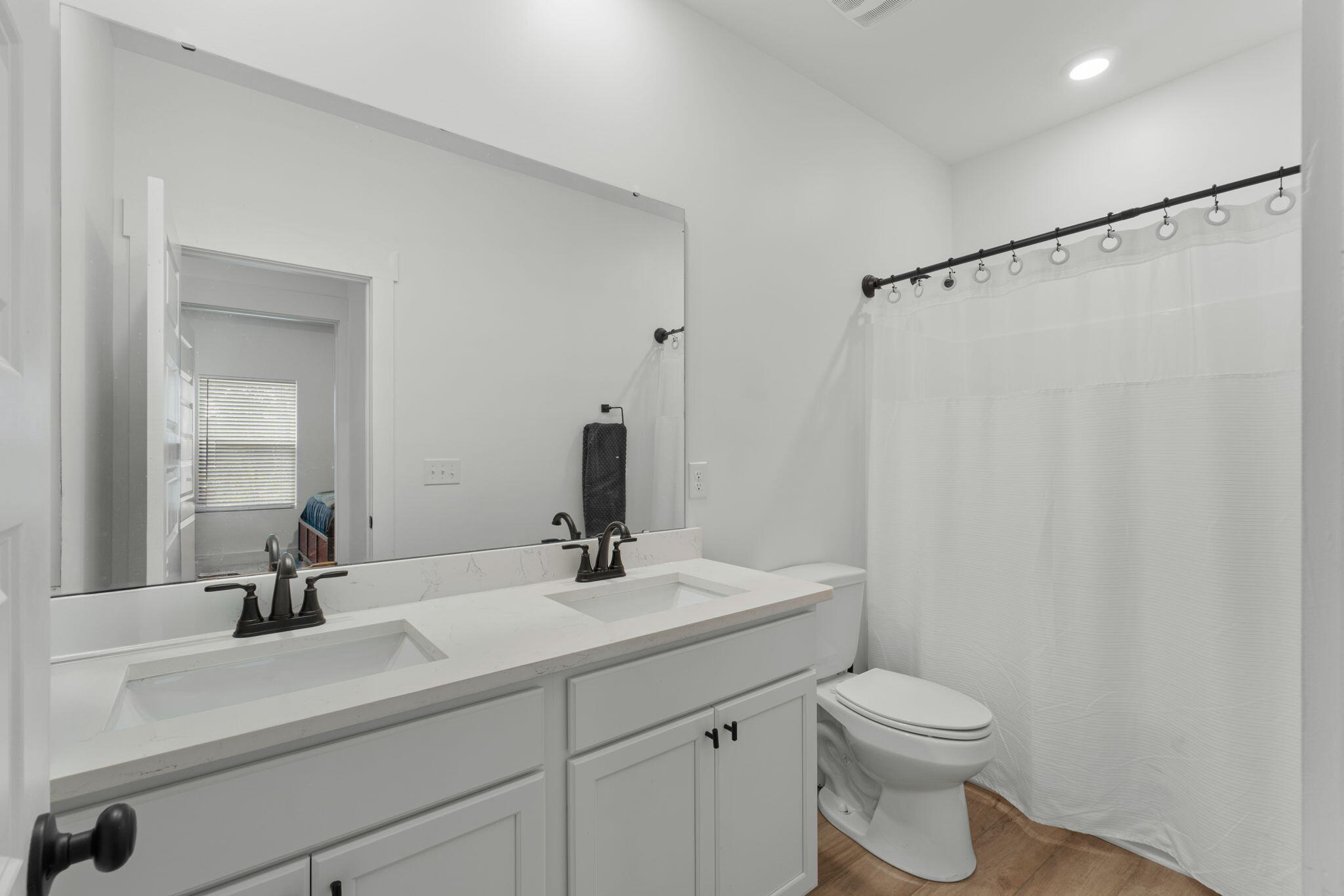 136 Hibernate Way Freeport, FL 32439 - Photo 20 of 55 a bathroom with a sink a toilet and mirror