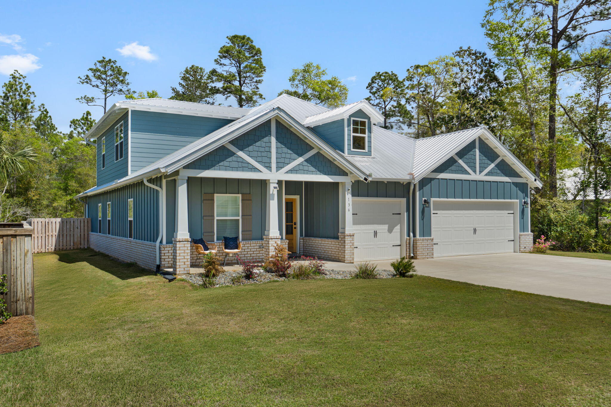 136 Hibernate Way Freeport, FL 32439 - Photo 2 of 55 a front view of a house with garden