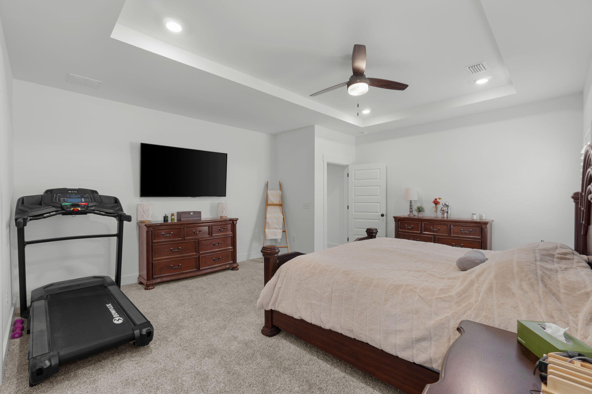 136 Hibernate Way Freeport, FL 32439 - Photo 22 of 55 a bedroom with a bed and a flat tv screen on dresser