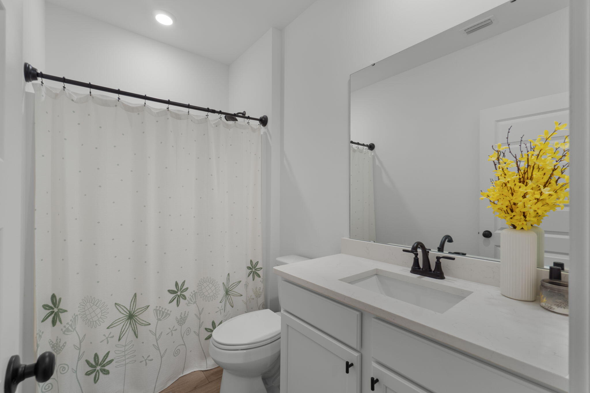 136 Hibernate Way Freeport, FL 32439 - Photo 26 of 55 a bathroom with a sink a toilet and a mirror