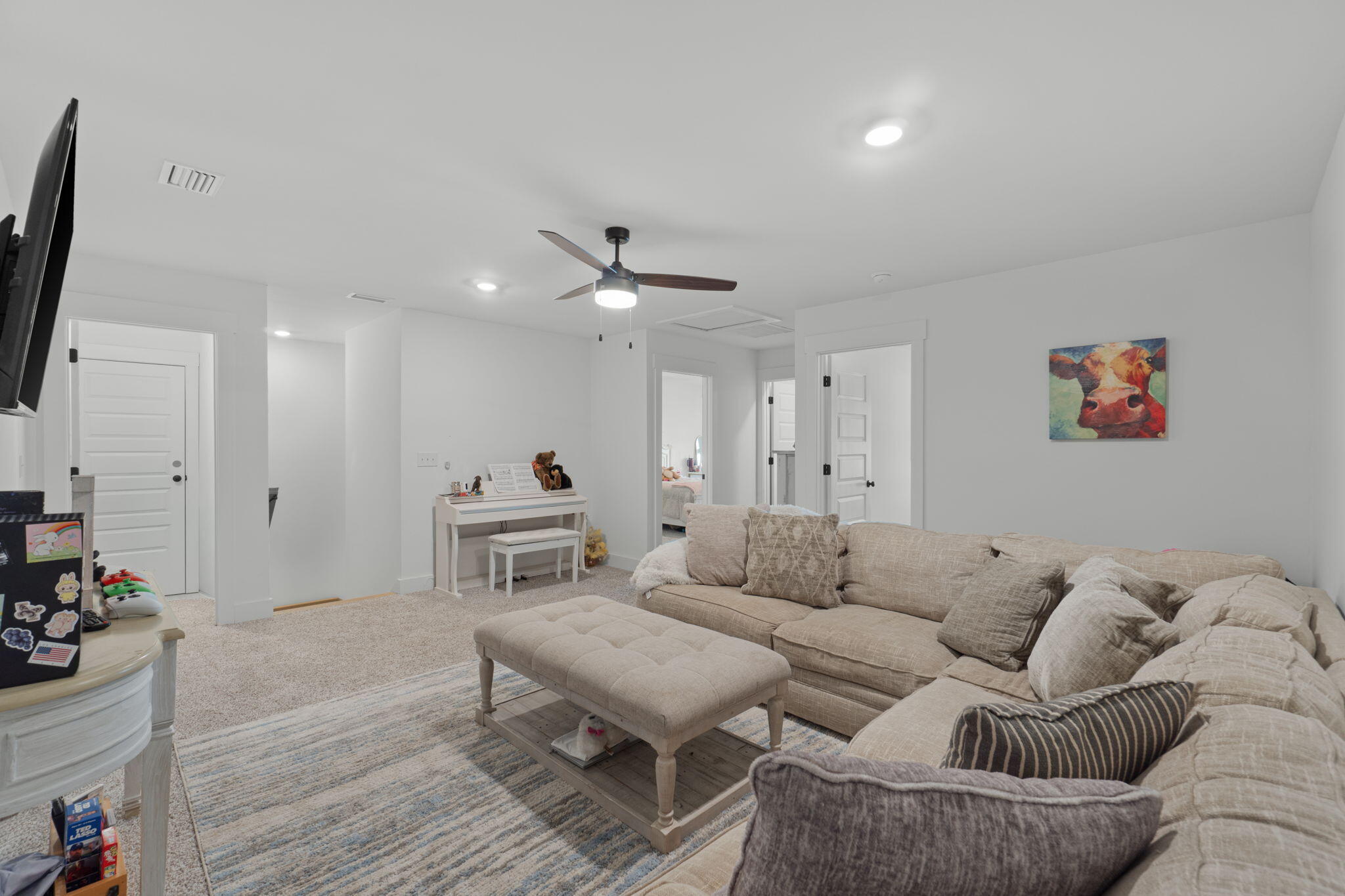 136 Hibernate Way Freeport, FL 32439 - Photo 29 of 55 a living room with furniture and a flat screen tv