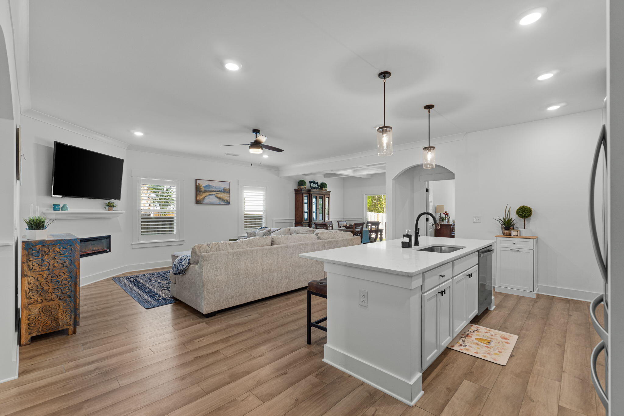 136 Hibernate Way Freeport, FL 32439 - Photo 7 of 55 a open kitchen with sink cabinets and wooden floor