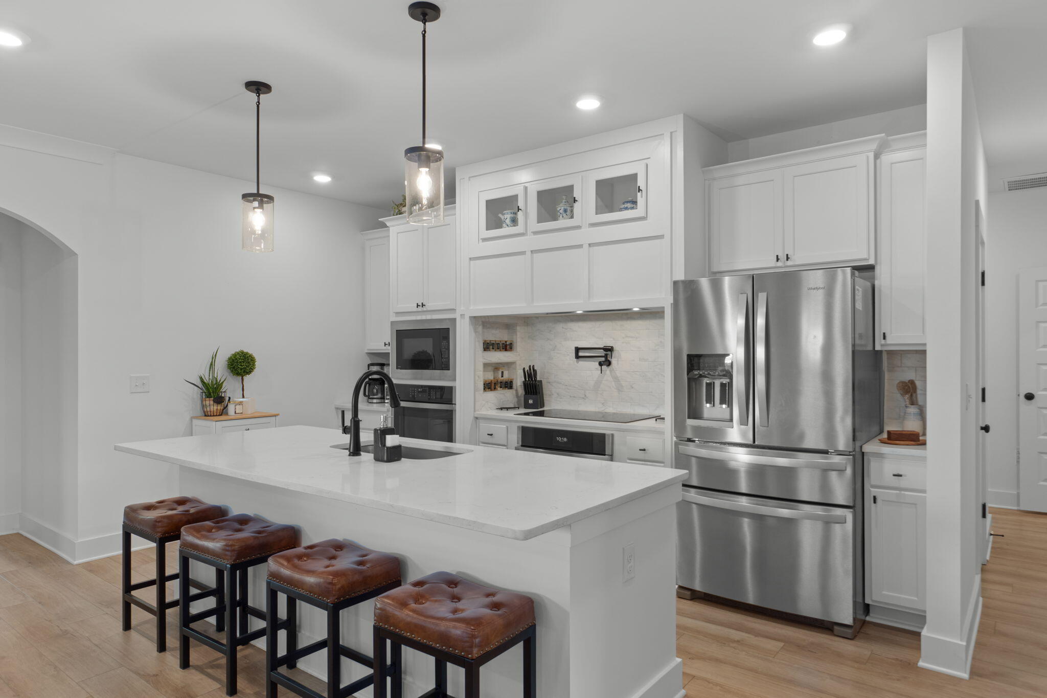 136 Hibernate Way Freeport, FL 32439 - Photo 9 of 55 a kitchen with kitchen island white cabinets and stainless steel appliances