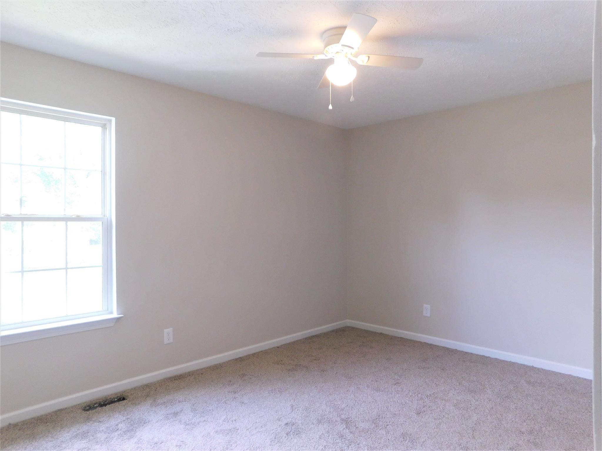 121 Rodeo Drive Columbia, TN 38401 - Photo 7 of 10 Bedroom 3 has new carpet, new ceiling fan, all repainted.