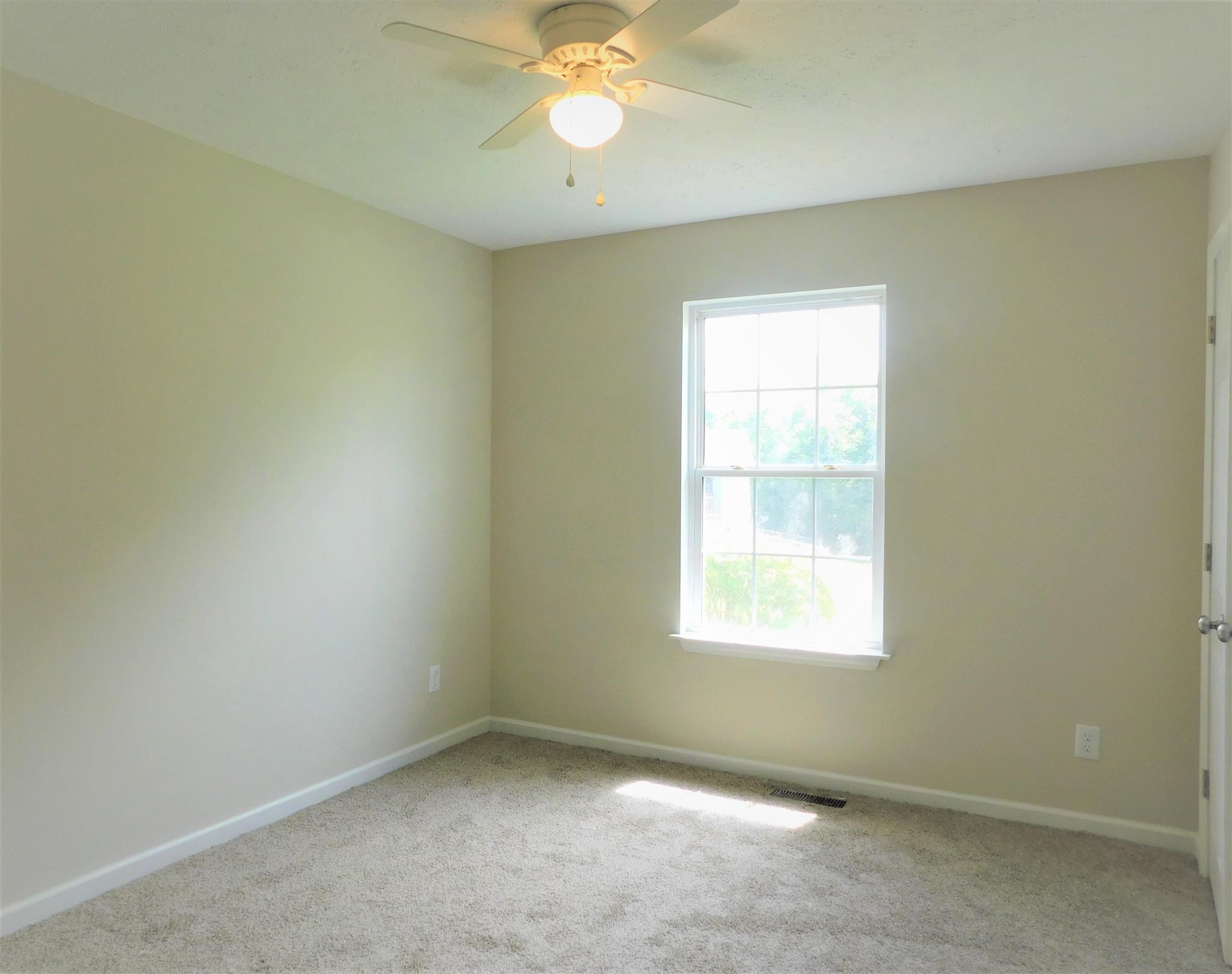 121 Rodeo Drive Columbia, TN 38401 - Photo 8 of 10 Bedroom 4 has new carpet, new ceiling fan, all repainted.