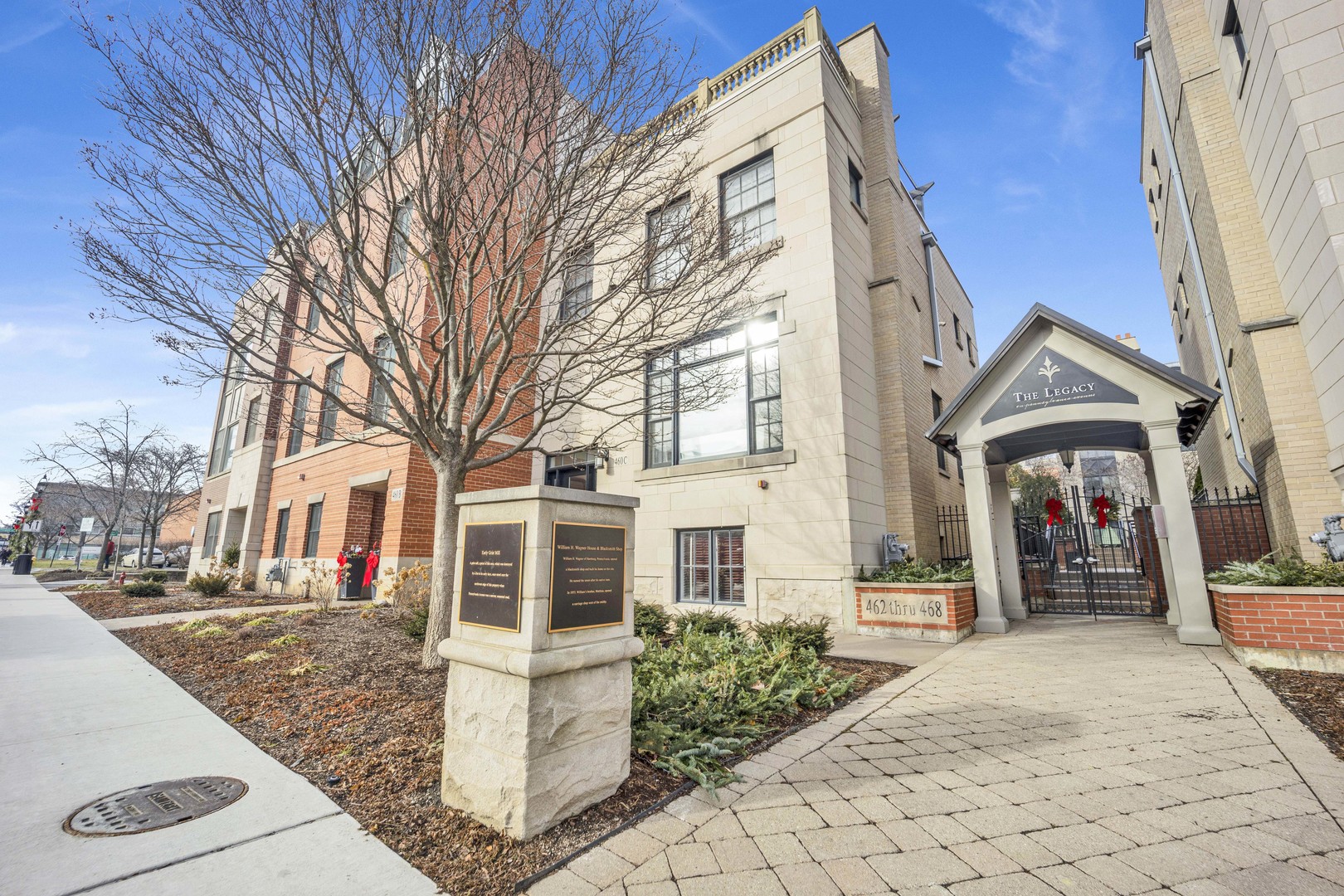 460 Pennsylvania Avenue, Unit C Glen Ellyn, IL 60137 - Photo 1 of 37 a front view of a house with a yard