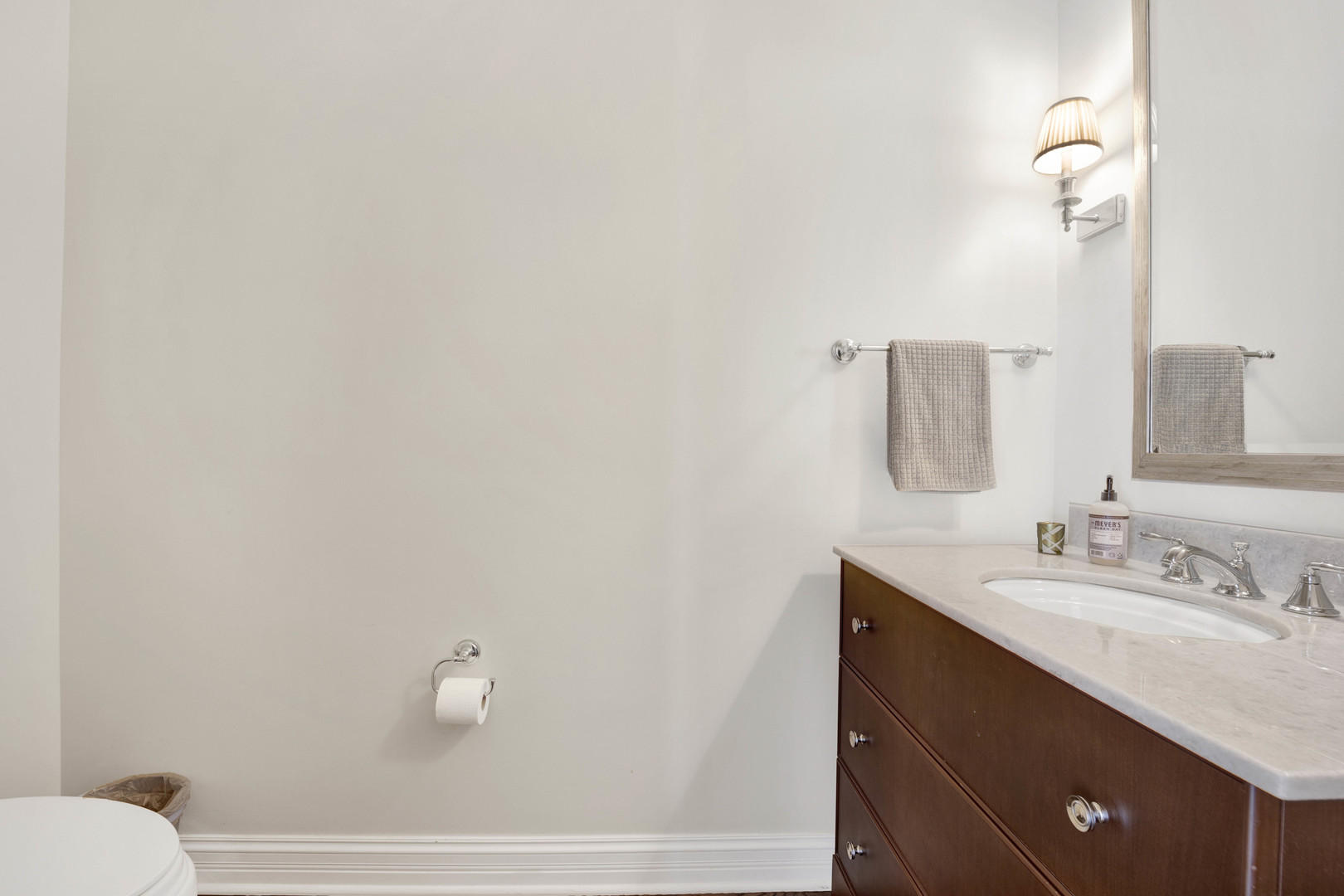 460 Pennsylvania Avenue, Unit C Glen Ellyn, IL 60137 - Photo 18 of 37 a bathroom with a sink and a mirror