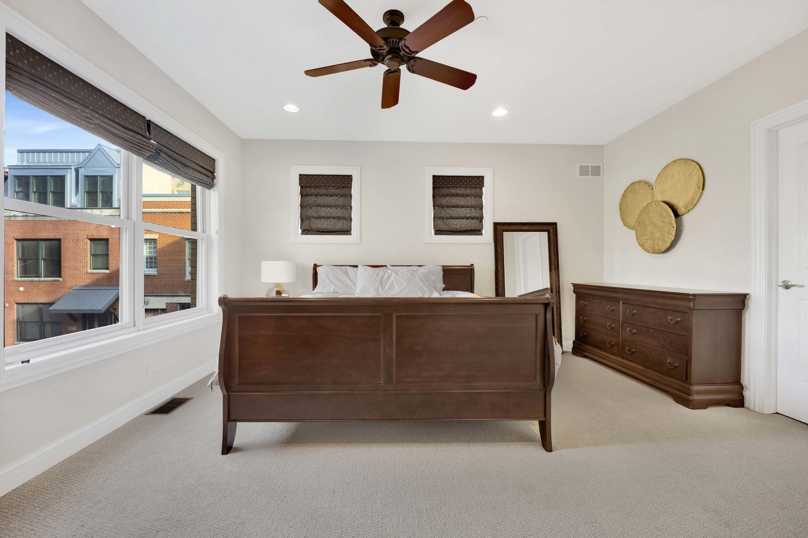 460 Pennsylvania Avenue, Unit C Glen Ellyn, IL 60137 - Photo 24 of 37 a living room with a bed furniture and a window