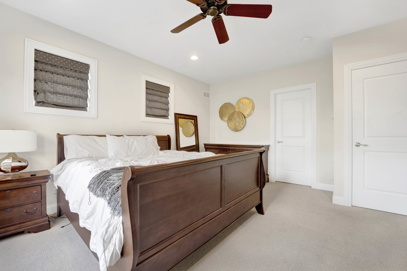 460 Pennsylvania Avenue, Unit C Glen Ellyn, IL 60137 - Photo 25 of 37 a bed room with a bed and painting on the wall