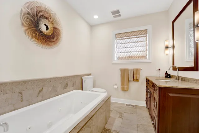 a bathroom with a bathtub and shower