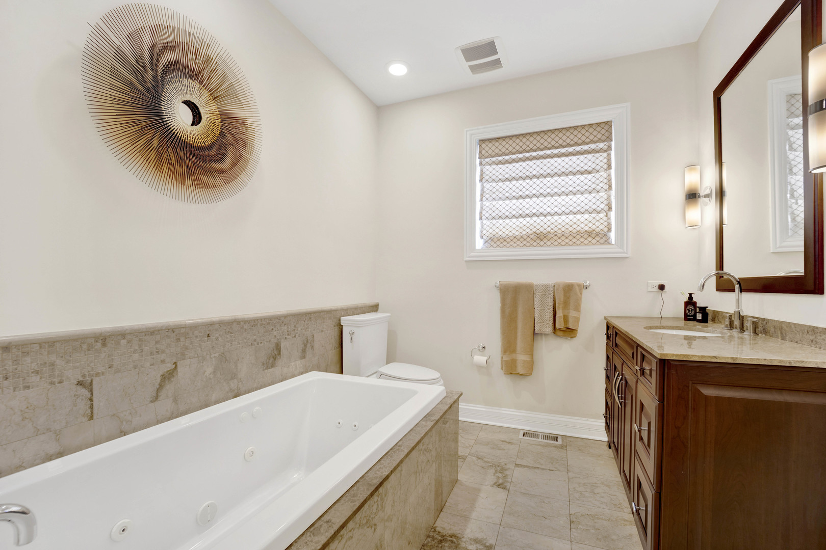 460 Pennsylvania Avenue, Unit C Glen Ellyn, IL 60137 - Photo 26 of 37 a bathroom with a sink and a mirror