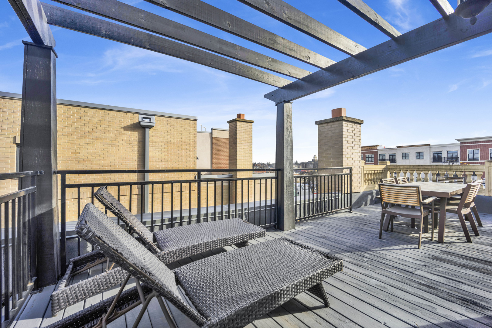 460 Pennsylvania Avenue, Unit C Glen Ellyn, IL 60137 - Photo 32 of 37 a balcony with wooden floor table and chairs