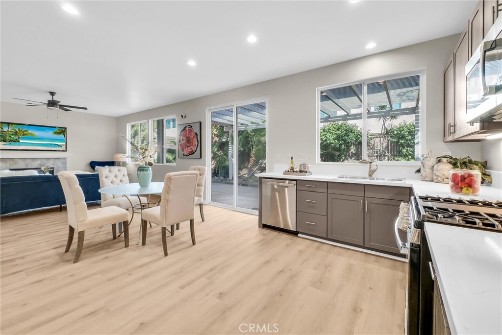 6732 Rico Court Eastvale, CA 92880 - Photo 11 of 30 a large white kitchen with a window