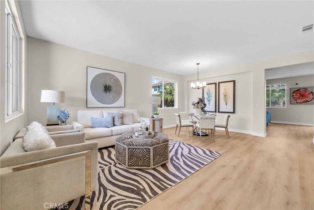 6732 Rico Court Eastvale, CA 92880 - Photo 5 of 30 a living room with furniture and a wooden floor