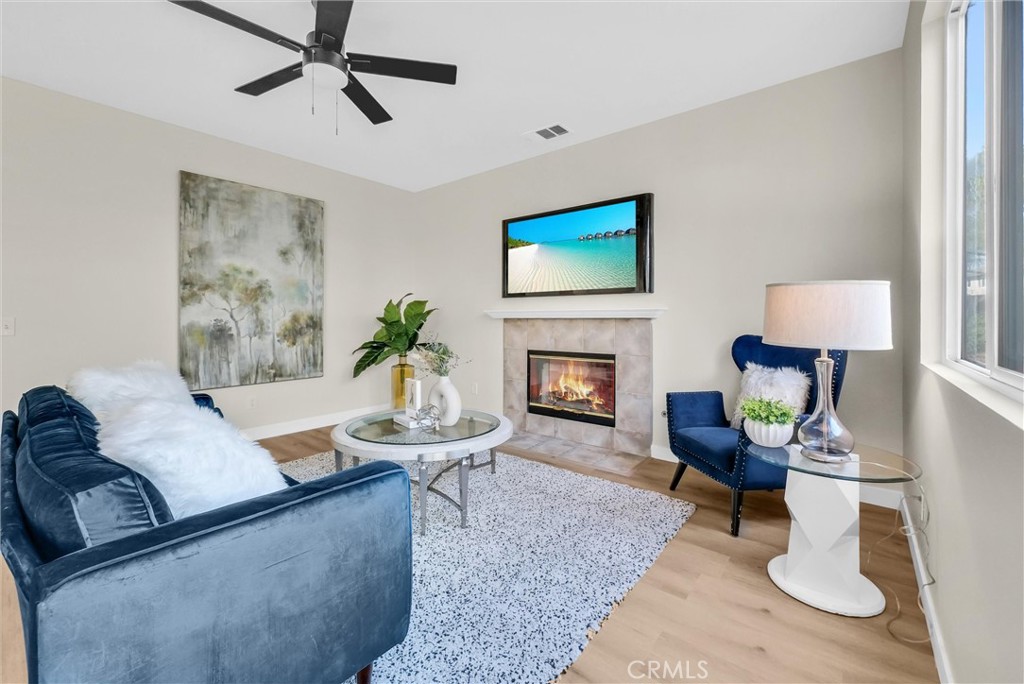 6732 Rico Court Eastvale, CA 92880 - Photo 8 of 30 a living room with furniture and a fireplace