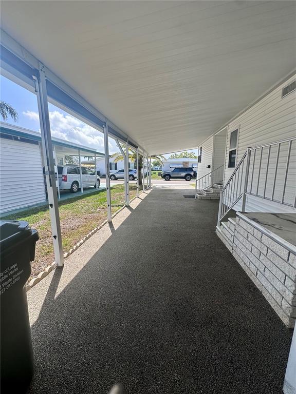 1100 South Belcher Road, Unit 406 Largo, FL 33771 - Photo 2 of 46 a view of an empty room with floor to ceiling windows