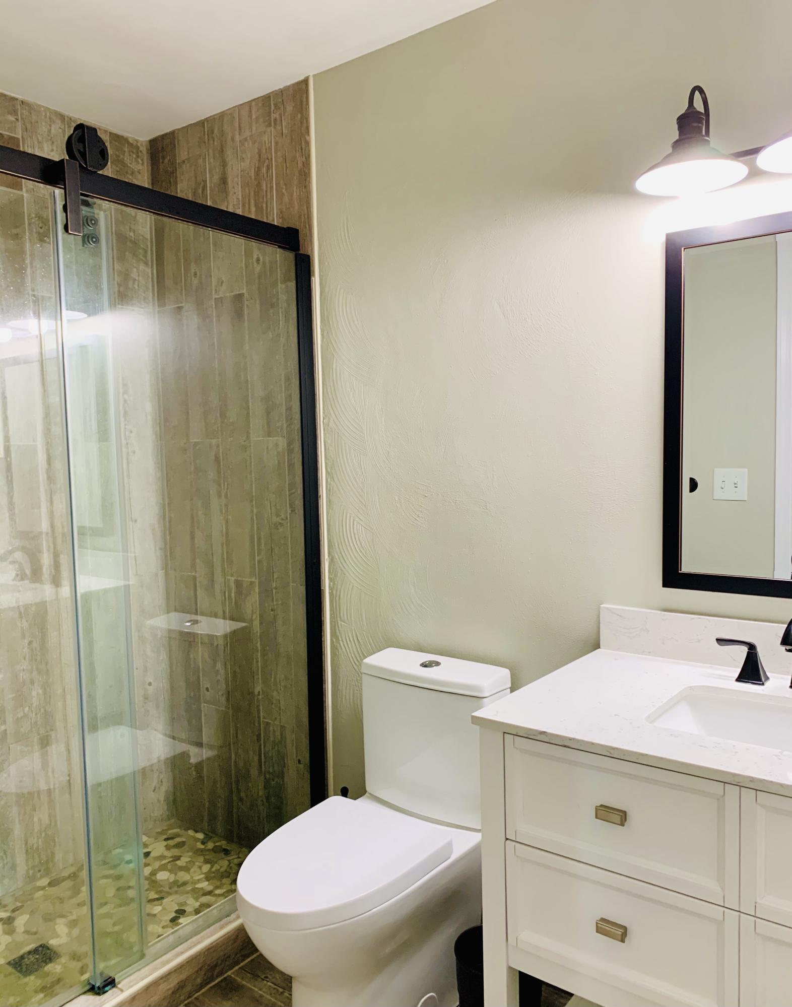1591 Sandy Level Road Goodview, VA 24095 - Photo 18 of 24 a bathroom with a sink toilet and shower