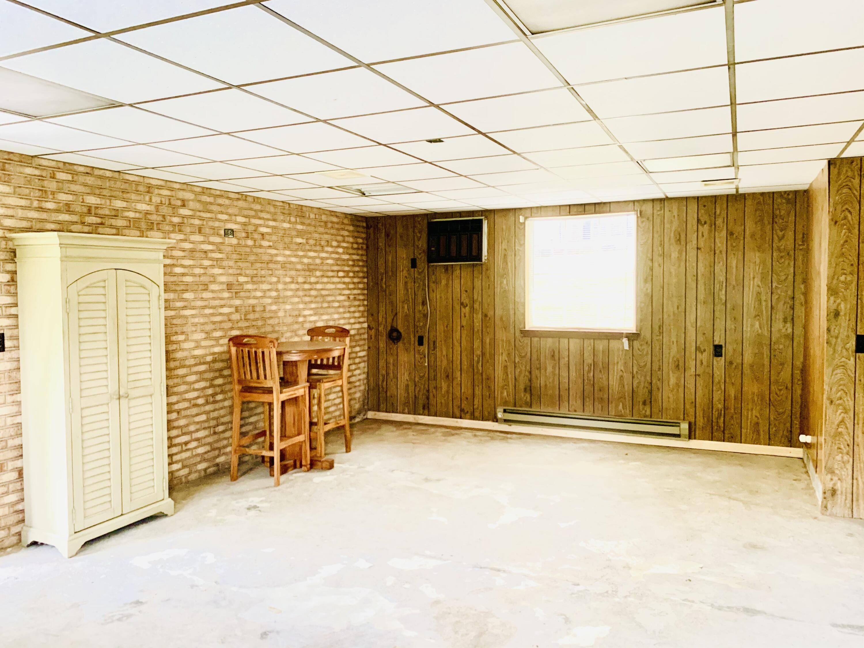 1591 Sandy Level Road Goodview, VA 24095 - Photo 21 of 24 an empty room with sliding door