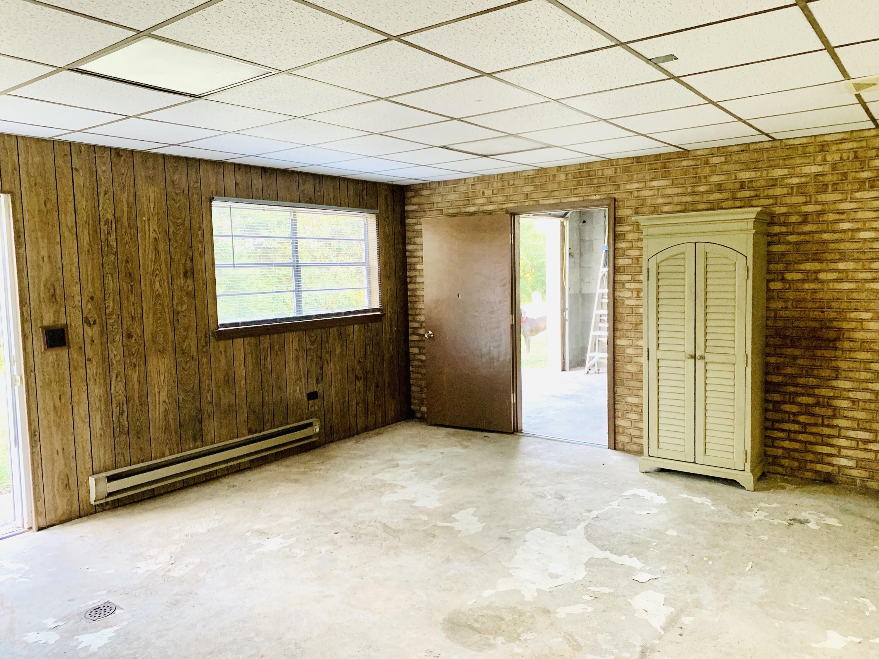 1591 Sandy Level Road Goodview, VA 24095 - Photo 22 of 24 an empty room with windows