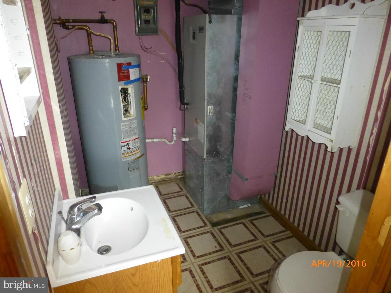 7726 Notley Road Pasadena, MD 21122 - Photo 17 of 18 Half Bath and Maintenance room