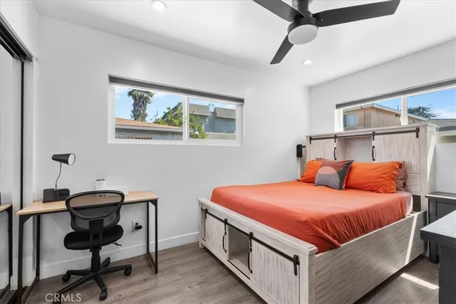 a bedroom with a bed and a desk