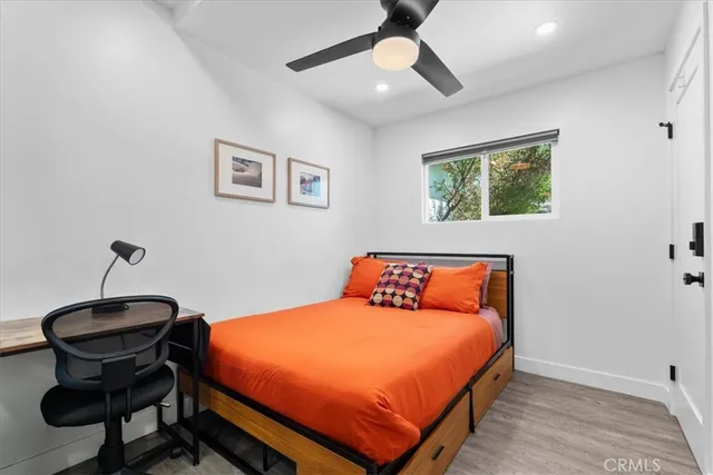 a bedroom with a bed and a chair