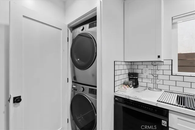 a view of a kitchen with washer and dryer