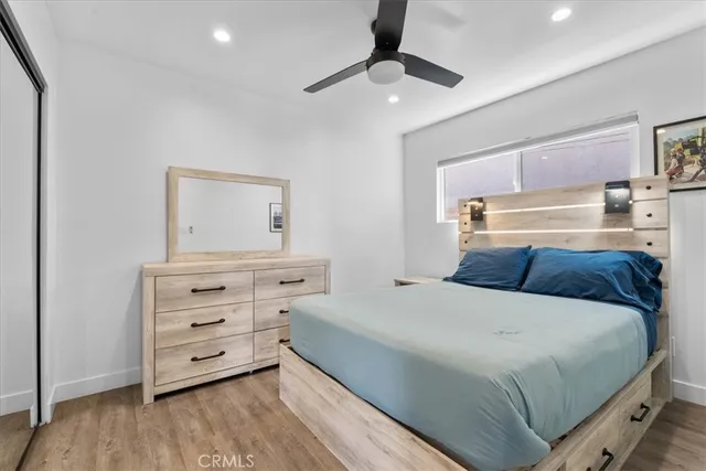 a bedroom with a bed and a dresser