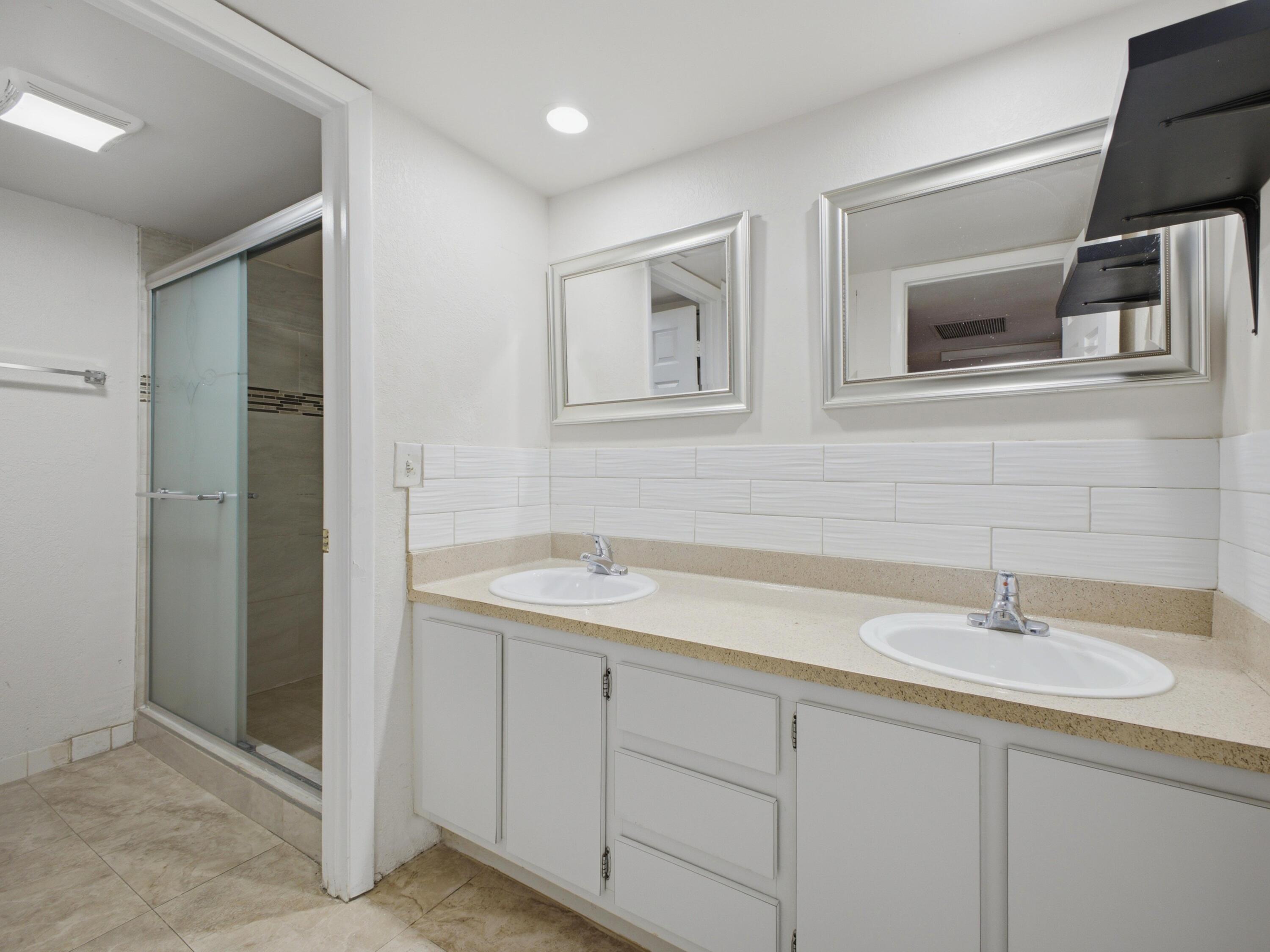 105 Woodland Road Palm Springs, FL 33461 - Photo 34 of 44 Shared Bathroom