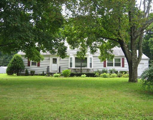 3 Dixon Road Danbury, CT 06811 - Photo 1 of 1 a front view of a house with a garden