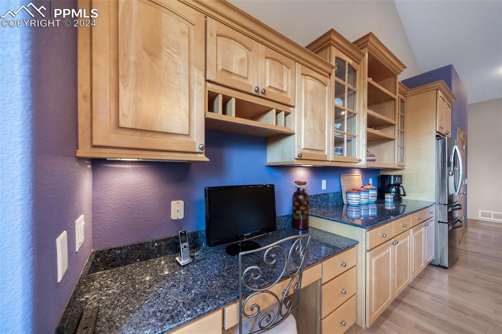 8174 Inca Road Larkspur, CO 80118 - Photo 16 of 50 a kitchen with stainless steel appliances granite countertop a stove a sink and a microwave