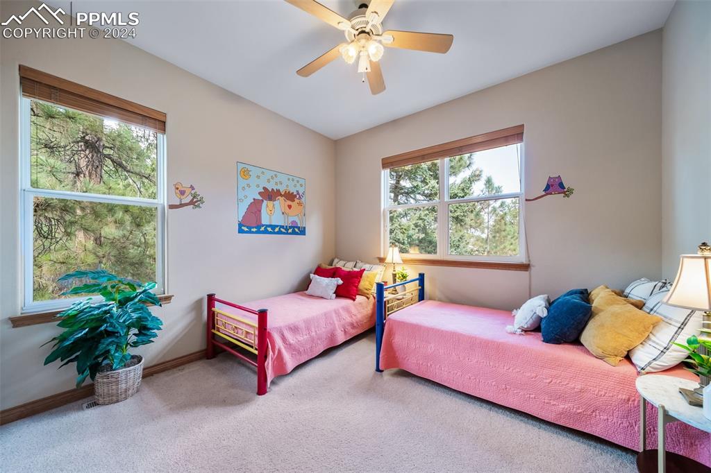 8174 Inca Road Larkspur, CO 80118 - Photo 30 of 50 a bedroom with a bed and a window