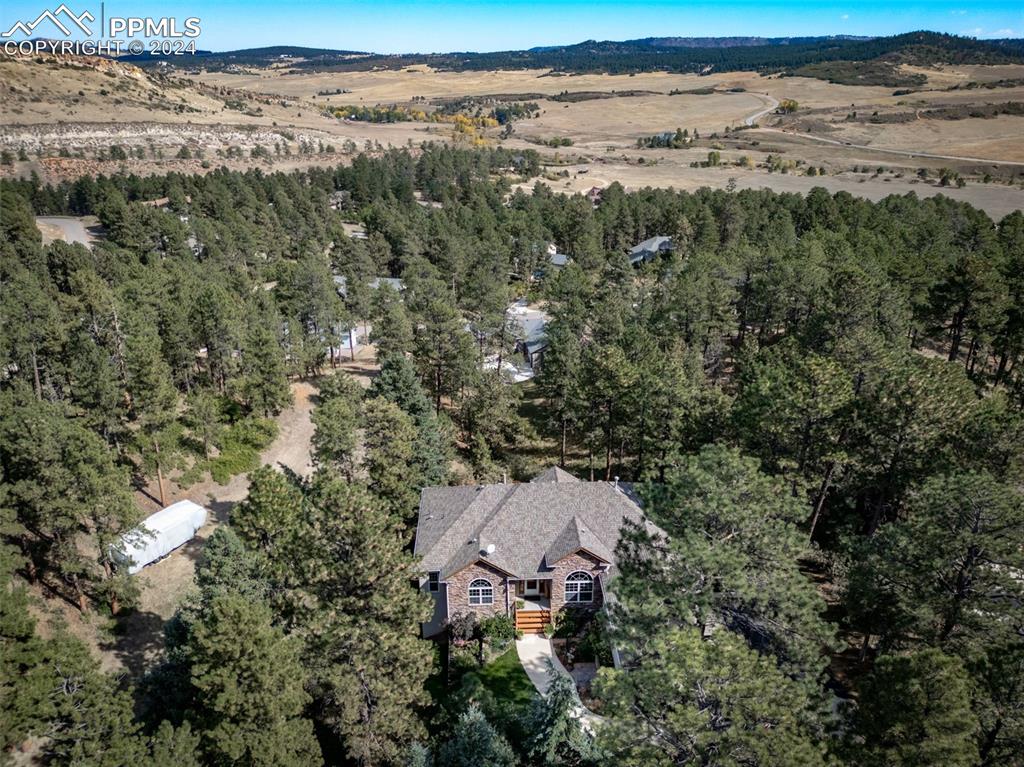 8174 Inca Road Larkspur, CO 80118 - Photo 3 of 50 an aerial view of a houses with beach