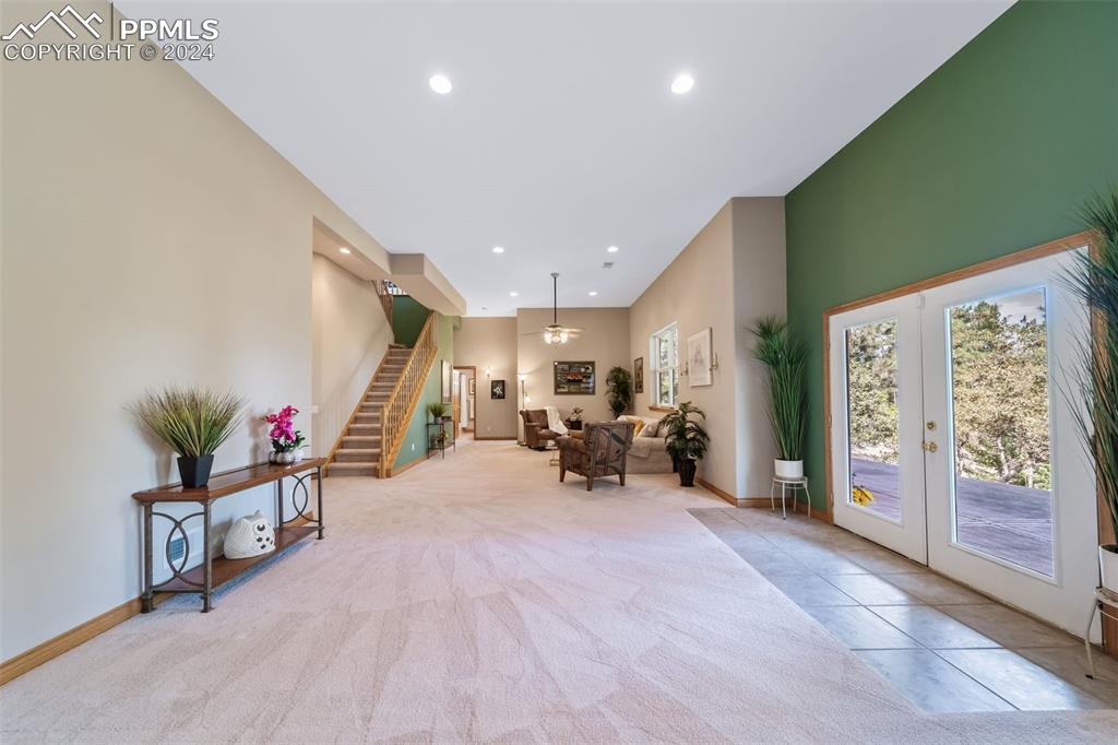 8174 Inca Road Larkspur, CO 80118 - Photo 37 of 50 a living room with furniture and a flat screen tv