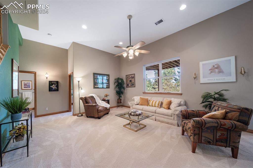 8174 Inca Road Larkspur, CO 80118 - Photo 38 of 50 a living room with furniture and a large window