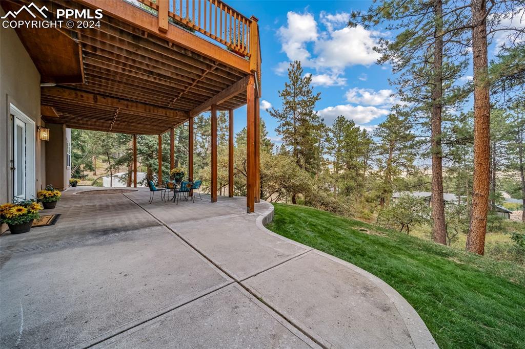 8174 Inca Road Larkspur, CO 80118 - Photo 45 of 50 a view of backyard with plants and trees