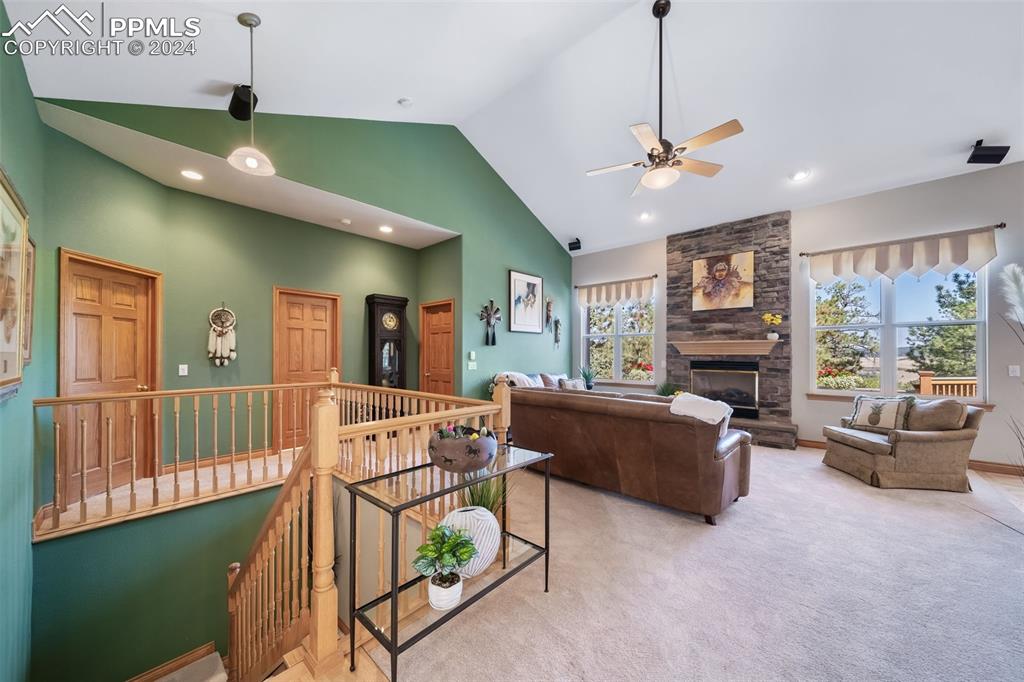 8174 Inca Road Larkspur, CO 80118 - Photo 5 of 50 a living room with furniture and a flat screen tv