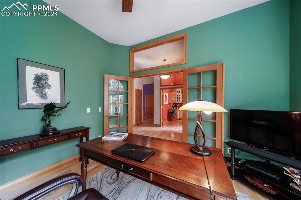 8174 Inca Road Larkspur, CO 80118 - Photo 7 of 50 a living room with furniture and a flat screen tv