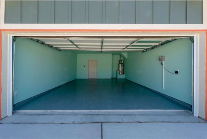 10805 Meris Lane Austin, TX 78754 - Photo 22 of 28 An immaculate garage features a freshly painted floor, offering a clean and versatile space.